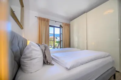 Ein Bett oder Betten in einem Zimmer der Unterkunft Olympia-Residence