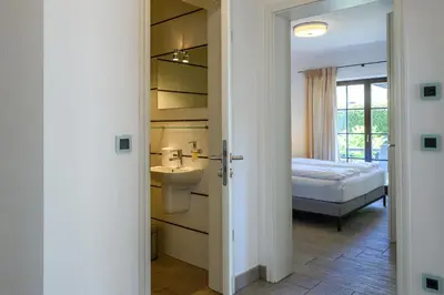 Ein Bett oder Betten in einem Zimmer der Unterkunft Olympia-Residence