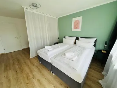Ein Bett oder Betten in einem Zimmer der Unterkunft 3BR stay close to Munich City & Airport