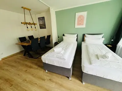 Ein Bett oder Betten in einem Zimmer der Unterkunft 3BR stay close to Munich City & Airport