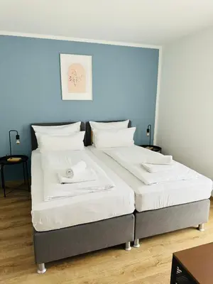 Ein Bett oder Betten in einem Zimmer der Unterkunft 3BR stay close to Munich City & Airport