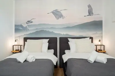 Ein Bett oder Betten in einem Zimmer der Unterkunft FENJOY Ferienapartments am Chiemsee - Balkon - BBQ