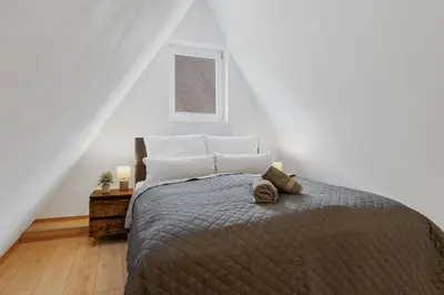 Ein Bett oder Betten in einem Zimmer der Unterkunft COMFY Altstadt-Loft Ingolstadt