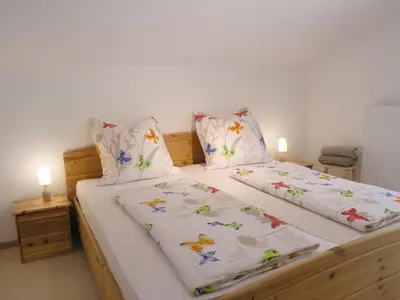 Ein Bett oder Betten in einem Zimmer der Unterkunft Ferienwohnung Anderl