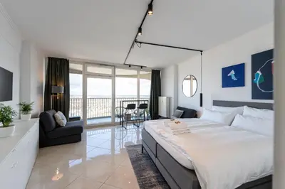 Ein Bett oder Betten in einem Zimmer der Unterkunft Apartment in der 30. Etage, Tolle Aussicht, Zentral