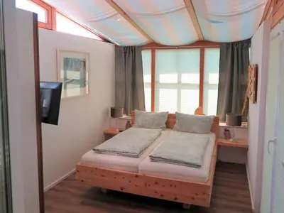 Ein Bett oder Betten in einem Zimmer der Unterkunft Dennenboomdroom