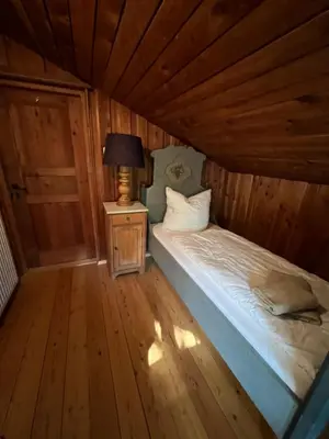 Ein Bett oder Betten in einem Zimmer der Unterkunft Haus Bergsteigerglück