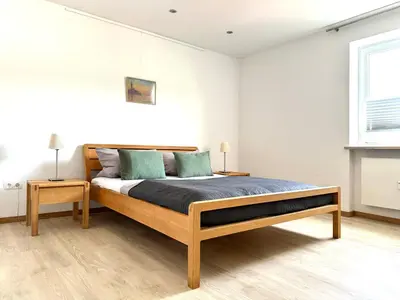 Ein Bett oder Betten in einem Zimmer der Unterkunft Ferienwohnung Sonnenblick