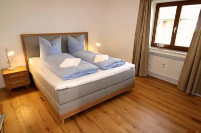Ein Bett oder Betten in einem Zimmer der Unterkunft Isarkindl