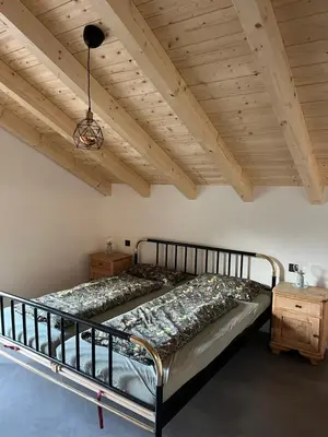 Ein Bett oder Betten in einem Zimmer der Unterkunft Mountain Hideout Wolfsee