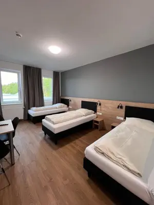 Ein Bett oder Betten in einem Zimmer der Unterkunft Firstsleep Ebersberg