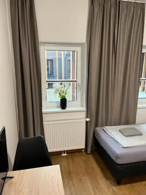 Ein Bett oder Betten in einem Zimmer der Unterkunft Firstsleep Ebersberg