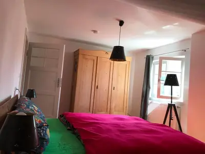 Ein Bett oder Betten in einem Zimmer der Unterkunft Dachgeschoss Wohnung mit Traum Bergblick