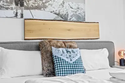 Ein Bett oder Betten in einem Zimmer der Unterkunft CASARINA - Alpentraum am Barmsee mit Garten