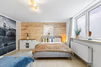 Ein Bett oder Betten in einem Zimmer der Unterkunft CASARINA - Alpentraum am Barmsee mit Garten