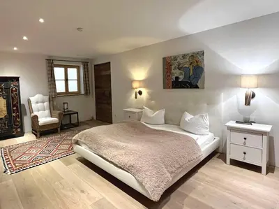 Ein Bett oder Betten in einem Zimmer der Unterkunft Landhaus Riedlern - Exklusives Ferienhaus in Kreuth am Tegernsee