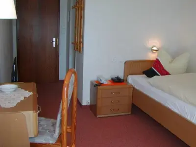 Ein Bett oder Betten in einem Zimmer der Unterkunft Kurhotel Eichwaldeck