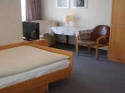 Ein Bett oder Betten in einem Zimmer der Unterkunft Kurhotel Eichwaldeck