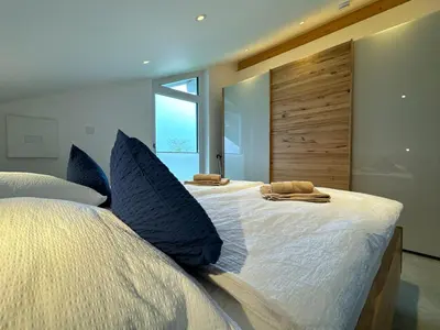 Ein Bett oder Betten in einem Zimmer der Unterkunft Ferienwohnung Eggstätt