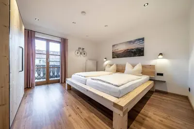 Ein Bett oder Betten in einem Zimmer der Unterkunft Ferienwohnungen Haus Heiss