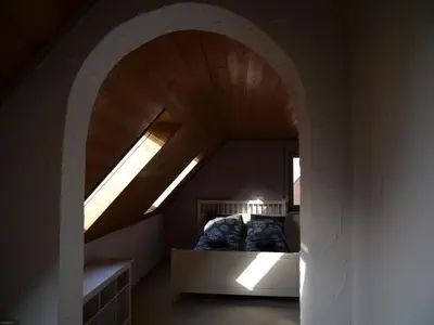 Ein Bett oder Betten in einem Zimmer der Unterkunft Ferienwohnung in Weichs