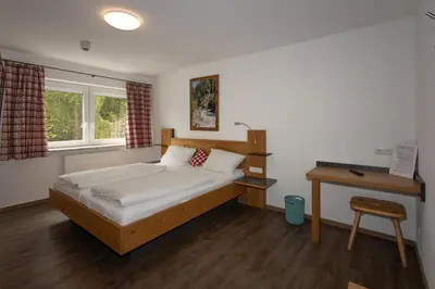 Ein Bett oder Betten in einem Zimmer der Unterkunft isarwinkel