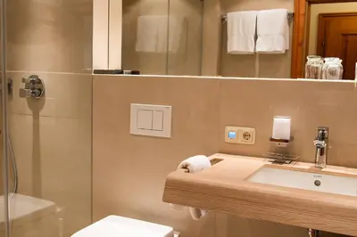 Ein Badezimmer in der Unterkunft Haus Lesch - Stilvolle Appartements mit tollem Bergblick in Kreuth am Tegernsee