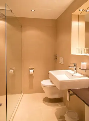 Ein Badezimmer in der Unterkunft Haus Lesch - Stilvolle Appartements mit tollem Bergblick in Kreuth am Tegernsee