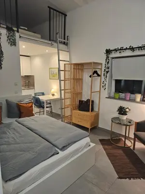 Ein Bett oder Betten in einem Zimmer der Unterkunft Estelada City Studios - Bogenhausen