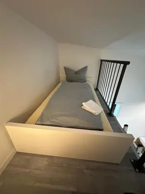 Ein Bett oder Betten in einem Zimmer der Unterkunft Estelada City Studios - Bogenhausen