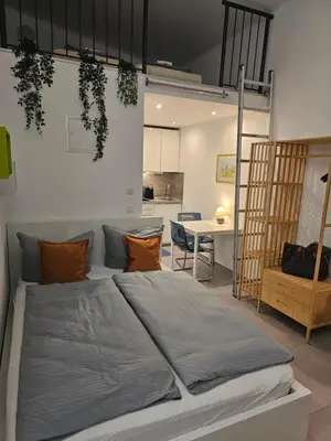Ein Bett oder Betten in einem Zimmer der Unterkunft Estelada City Studios - Bogenhausen