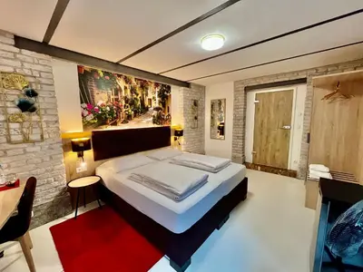 Ein Bett oder Betten in einem Zimmer der Unterkunft Adlzreiter City Pension