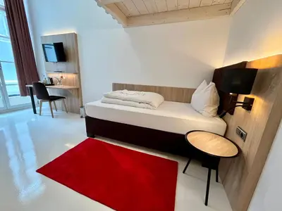 Ein Bett oder Betten in einem Zimmer der Unterkunft Adlzreiter City Pension
