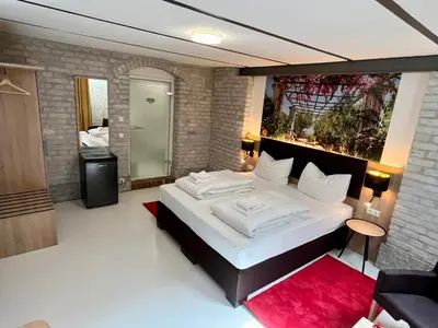 Ein Bett oder Betten in einem Zimmer der Unterkunft Adlzreiter City Pension