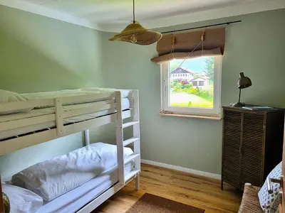 Ein Bett oder Betten in einem Zimmer der Unterkunft Boutique Ferienhaus Chiemsee