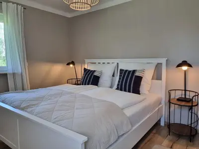 Ein Bett oder Betten in einem Zimmer der Unterkunft Boutique Ferienhaus Chiemsee