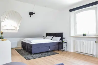 Ein Bett oder Betten in einem Zimmer der Unterkunft stycoz - Modernes Loft - 60 m2 - Küche - Parken