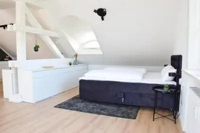 Ein Bett oder Betten in einem Zimmer der Unterkunft stycoz - Modernes Loft - 60 m2 - Küche - Parken
