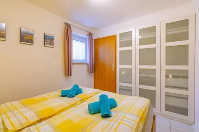 Ein Bett oder Betten in einem Zimmer der Unterkunft Ferienwohnungen Christoph in der Edelweißstraße