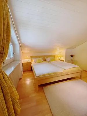 Ein Bett oder Betten in einem Zimmer der Unterkunft Ferienwohnung Wallner