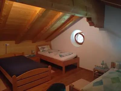 Ein Bett oder Betten in einem Zimmer der Unterkunft Arbeiterwohnung Entbuchner Hof