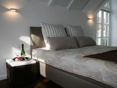 Ein Bett oder Betten in einem Zimmer der Unterkunft Charming Holiday Home in Herrsching