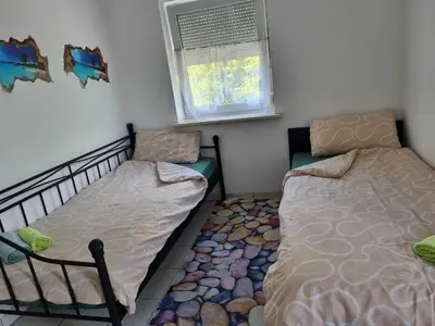 Ein Bett oder Betten in einem Zimmer der Unterkunft Monteurwohnung Weigl