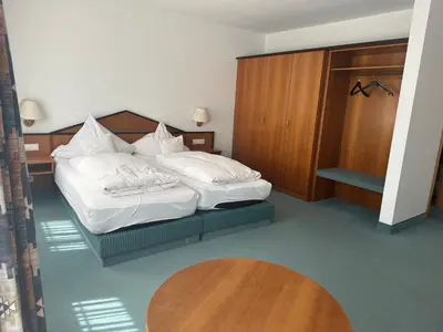 Ein Bett oder Betten in einem Zimmer der Unterkunft ST Hotel