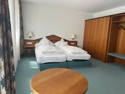 Ein Bett oder Betten in einem Zimmer der Unterkunft ST Hotel