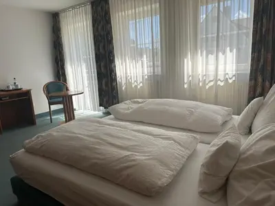 Ein Bett oder Betten in einem Zimmer der Unterkunft ST Hotel
