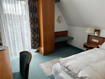 Ein Bett oder Betten in einem Zimmer der Unterkunft ST Hotel