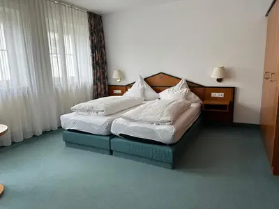 Ein Bett oder Betten in einem Zimmer der Unterkunft ST Hotel