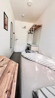 Ein Bett oder Betten in einem Zimmer der Unterkunft Lifestyle I Business I Netzwerken I Fitness - Einzelzimmer