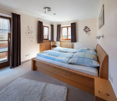Ein Bett oder Betten in einem Zimmer der Unterkunft Ferienwohnungen Lohbinder Fam Holzer